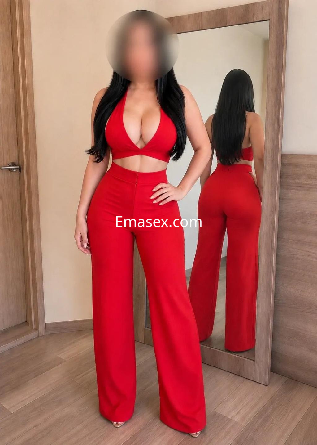 Escort en Zaragoza con cabello largo y oscuro, vistiendo un conjunto rojo ajustado y pantalones de talle alto.